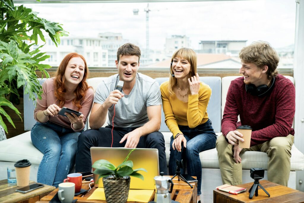 Millennial creative streamer group recording video broadcasting live on social media platforms